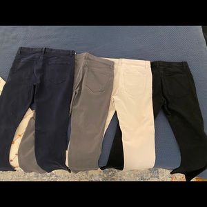 Four pairs of Banana Republic Travelers Pants.